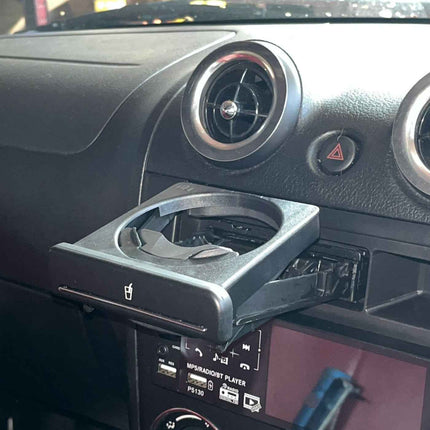 Schurkee Daihatsu Copen L880K cupholder, a sleek black car interior accessory for the Daihatsu Copen L880K model.