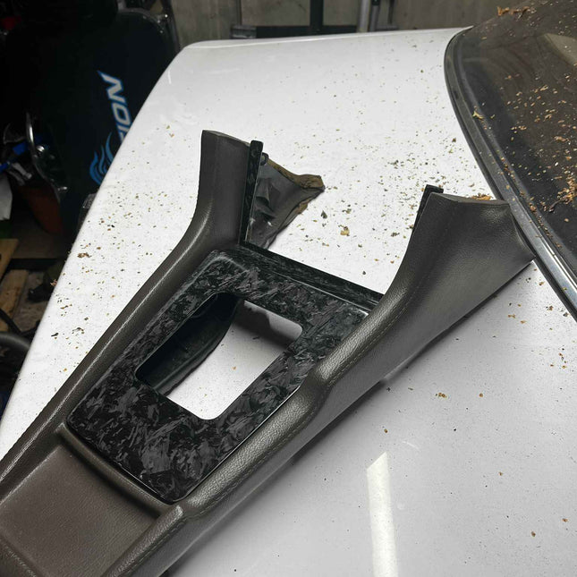 SCHURKEE Z20 Soarer forged carbon fiber shifter surround, close-up view showing sleek black finish and precise edges.